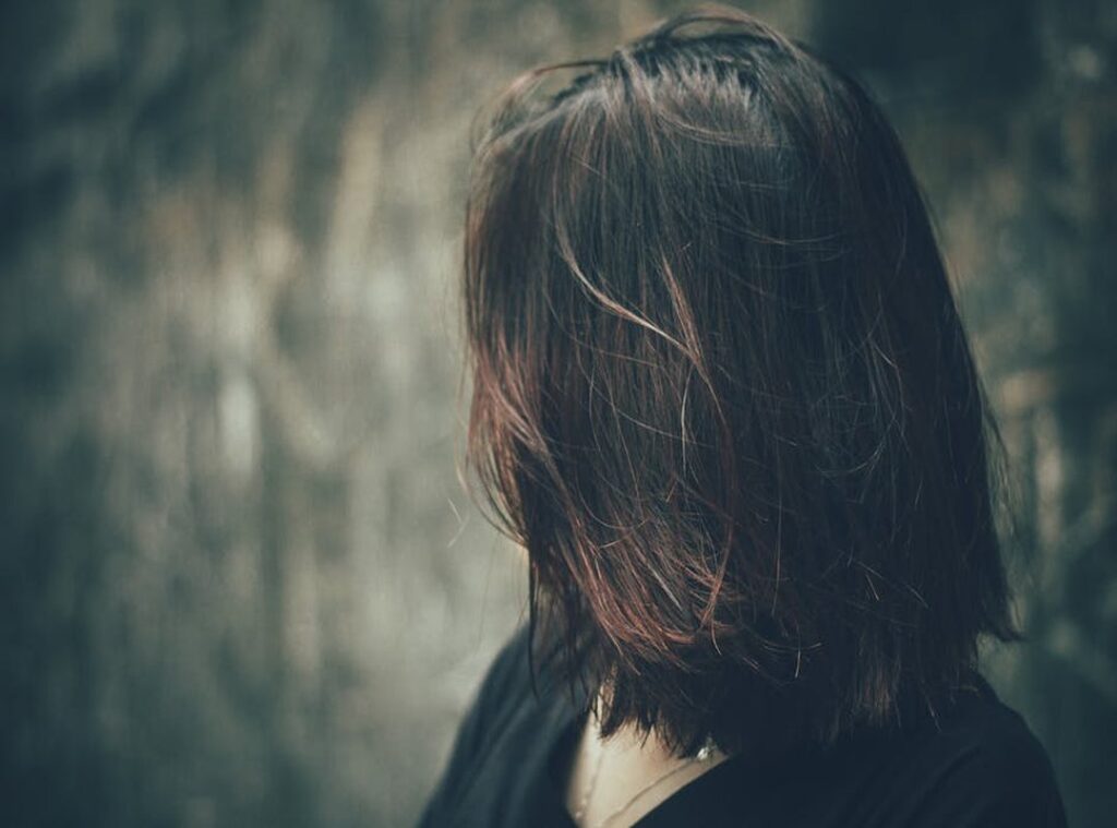 attitude girl hidden face with hair